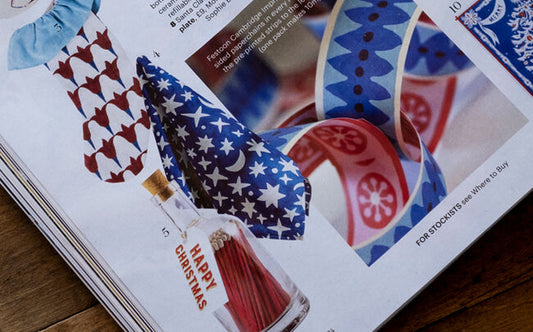 Star tea towel with blue background featured in Country Living magazine