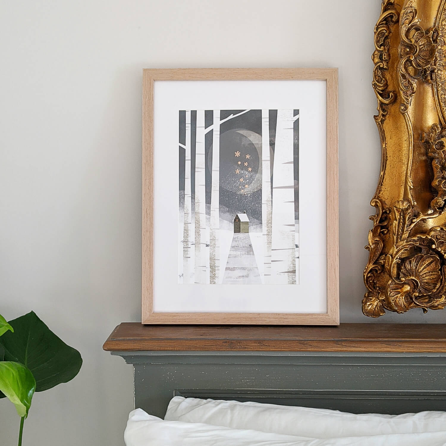 House Under The Moon Print in Gold Frame Displayed in Bedroom