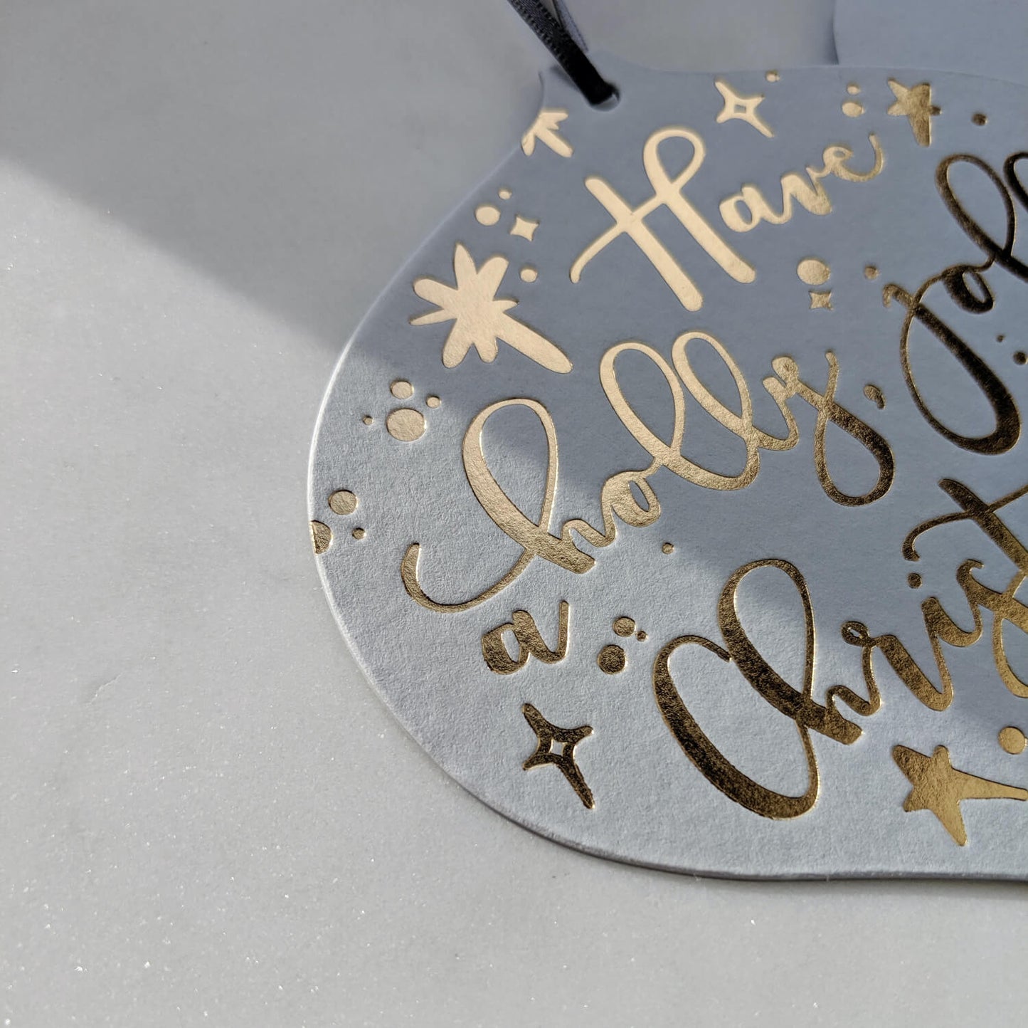 Gold Bauble Christmas Card Decoration with grey ribbon to hang on the tree