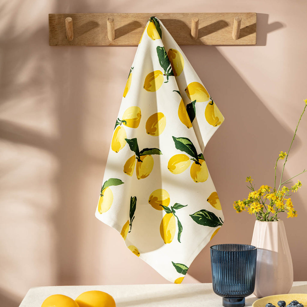 Lemon Tea Towel hanging in a pink kitchen - The Moonlit Press UK